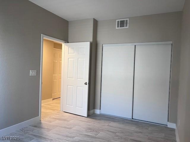 unfurnished bedroom featuring a closet