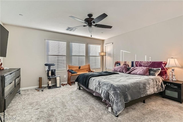 bedroom featuring ceiling fan and light carpet