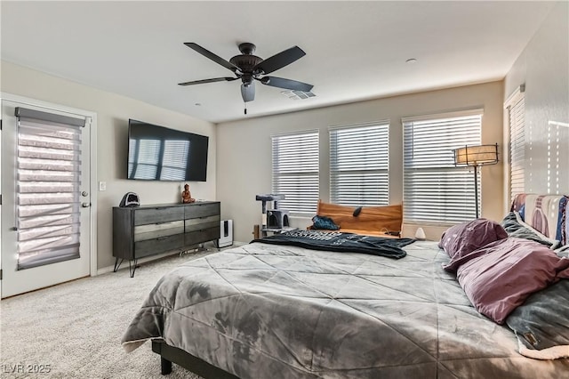 bedroom with carpet floors, ceiling fan, access to exterior, and multiple windows