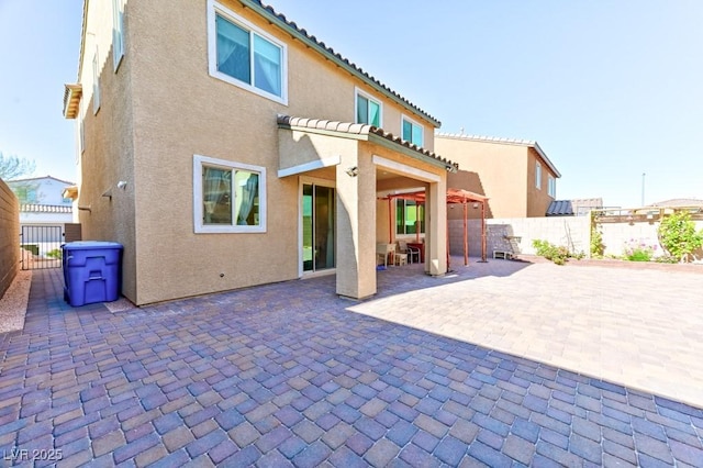 back of property with a patio area