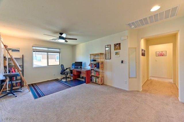 office featuring ceiling fan and light carpet