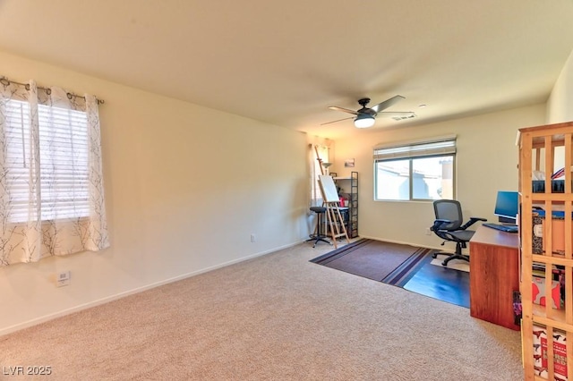 home office featuring carpet floors and ceiling fan