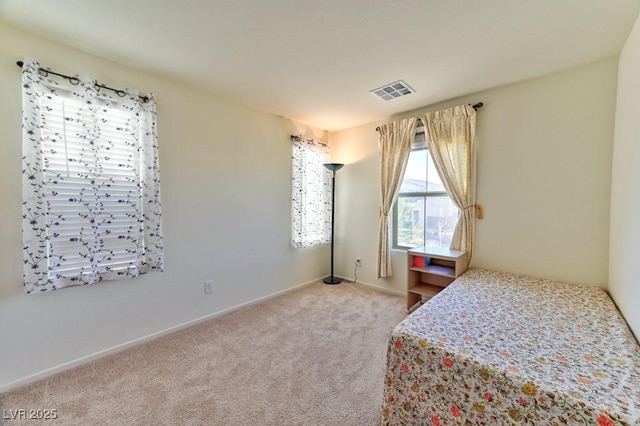 bedroom with light colored carpet