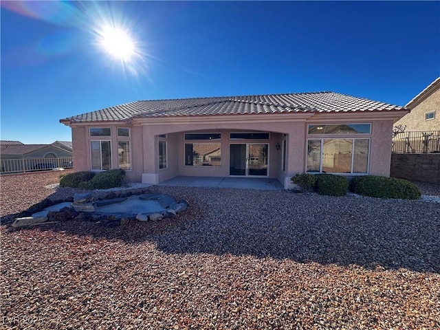 rear view of house with a patio