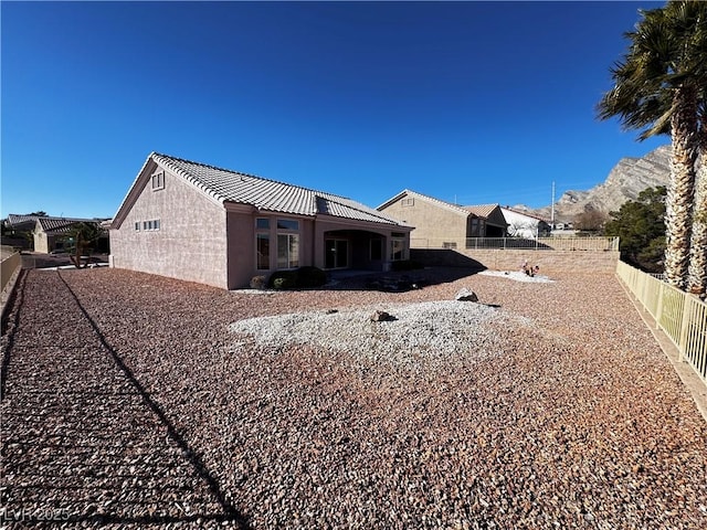 rear view of property with a mountain view