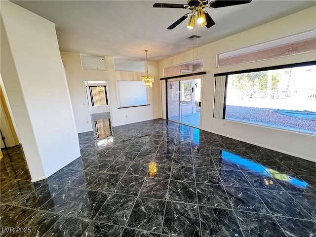 kitchen with ceiling fan with notable chandelier and decorative light fixtures