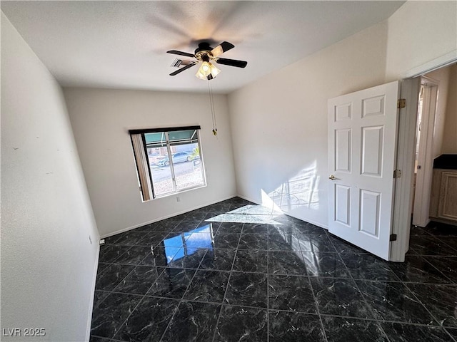 unfurnished room featuring ceiling fan