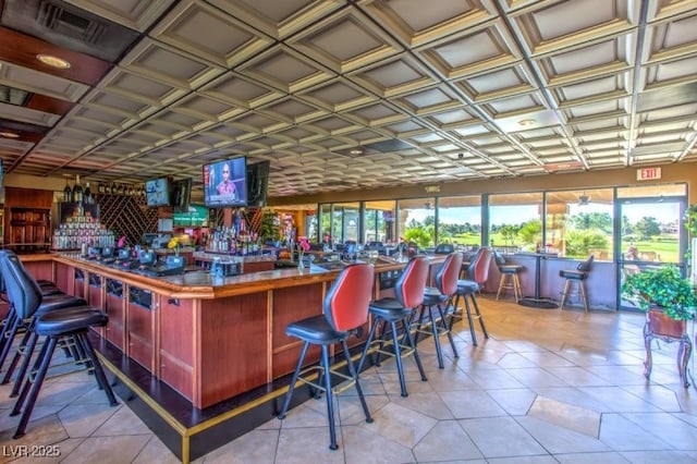 bar featuring light tile patterned flooring