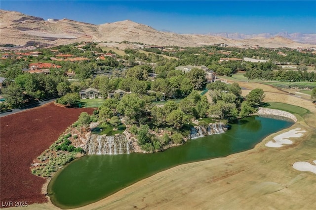 drone / aerial view featuring a water and mountain view