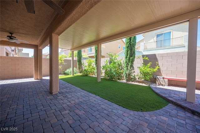 view of patio featuring ceiling fan