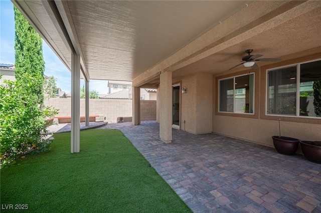 view of patio featuring ceiling fan