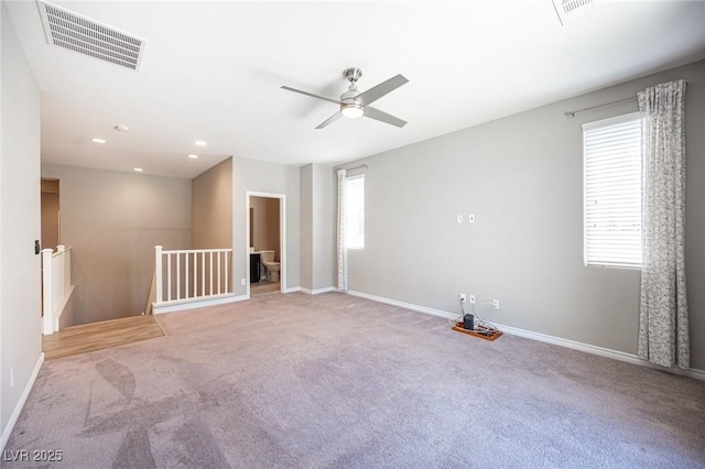 unfurnished room featuring ceiling fan, plenty of natural light, and carpet flooring