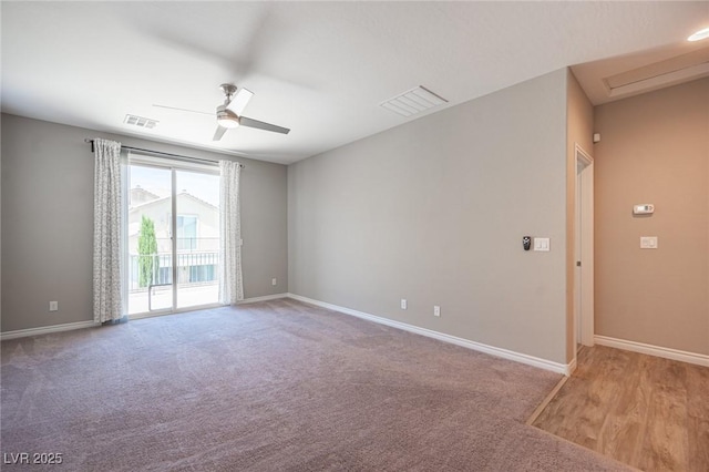 empty room featuring ceiling fan and carpet flooring