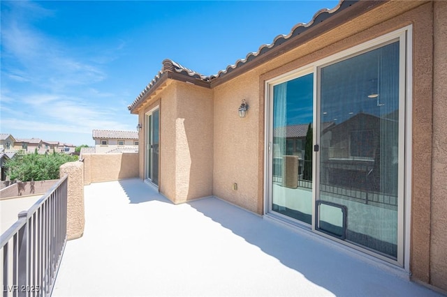 view of patio featuring a balcony