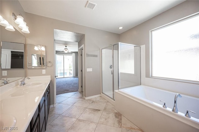 bathroom with ceiling fan, separate shower and tub, tile patterned floors, and vanity