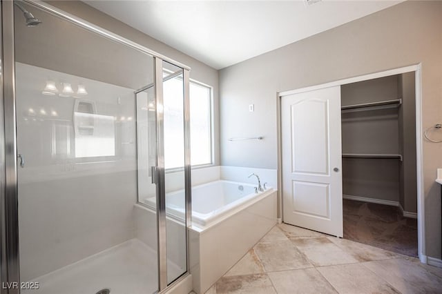 bathroom with separate shower and tub and tile patterned floors