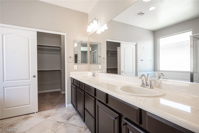 bathroom featuring tile patterned flooring and vanity