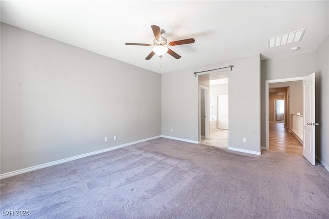 unfurnished bedroom featuring ceiling fan and light colored carpet