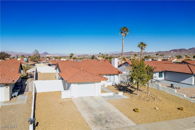 view of front of home featuring a mountain view and a garage