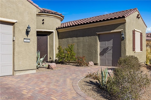 entrance to property featuring a garage