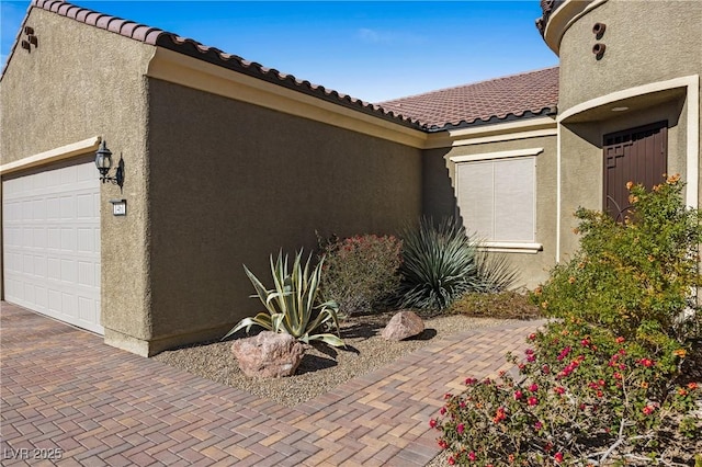 view of side of property with a garage