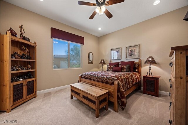 bedroom featuring ceiling fan and light carpet