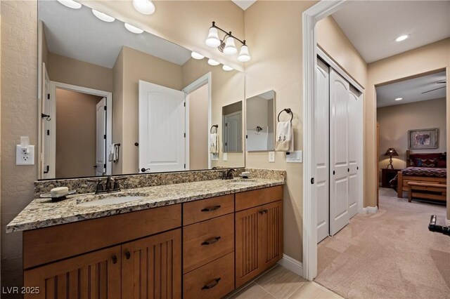 bathroom featuring tile patterned flooring and vanity