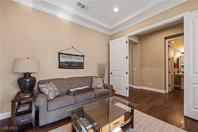 living room featuring ornamental molding and dark hardwood / wood-style floors