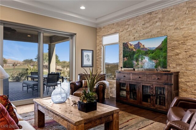 sitting room featuring ornamental molding, dark hardwood / wood-style floors, and plenty of natural light