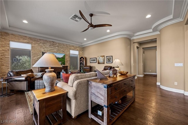 living room with dark hardwood / wood-style flooring, ceiling fan, and crown molding