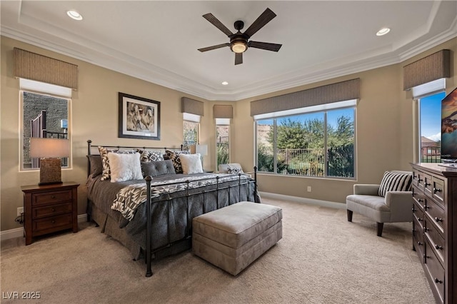 bedroom with multiple windows, ceiling fan, crown molding, and light colored carpet