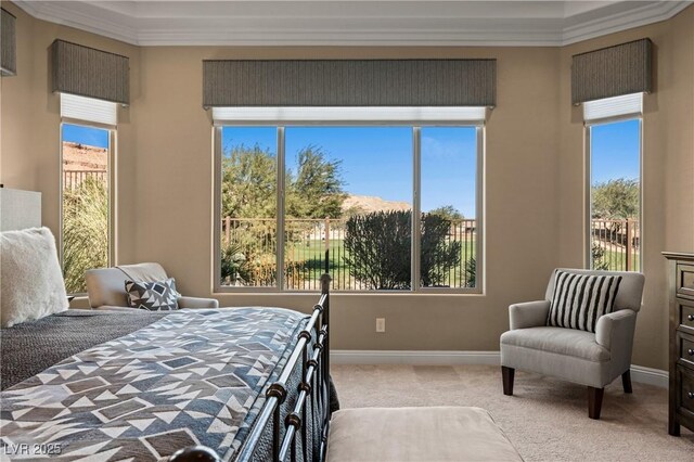 bedroom with ornamental molding and light carpet