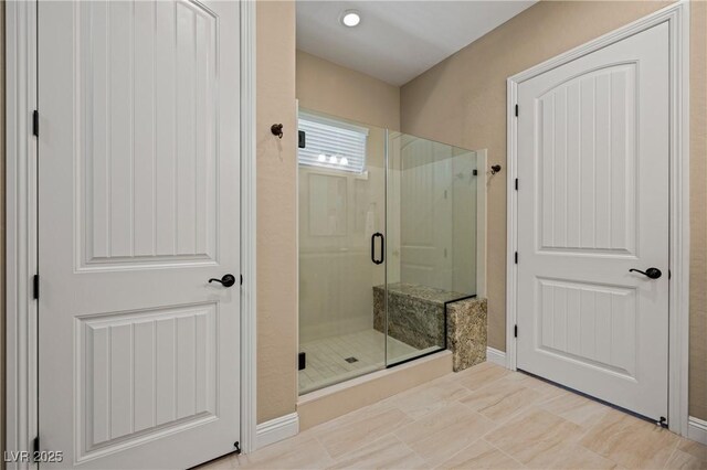 bathroom with an enclosed shower