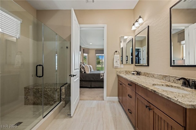 bathroom featuring vanity and a shower with shower door