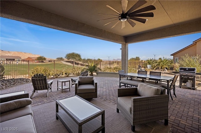 view of patio / terrace featuring grilling area, ceiling fan, and an outdoor living space