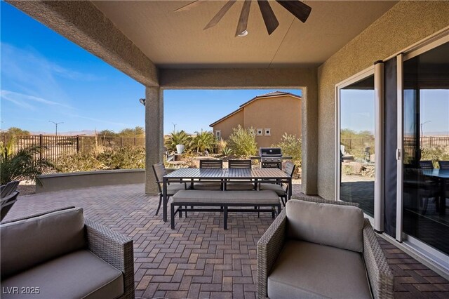 view of patio / terrace with ceiling fan and area for grilling