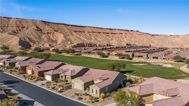 birds eye view of property featuring a mountain view