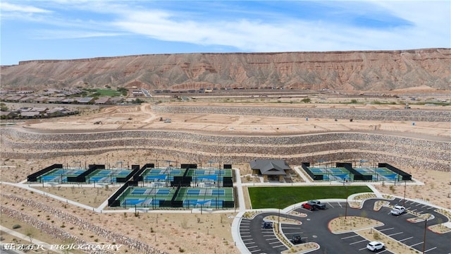 birds eye view of property with a mountain view