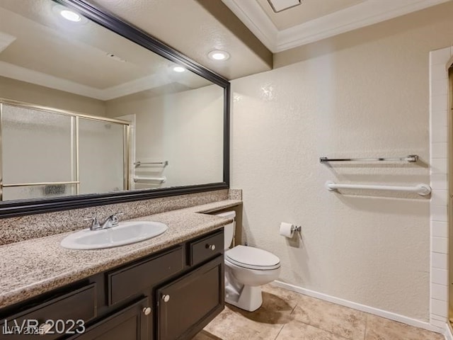 bathroom featuring toilet, tile patterned floors, an enclosed shower, vanity, and crown molding