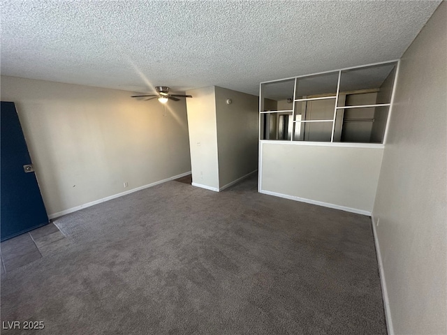 carpeted empty room with a textured ceiling and ceiling fan