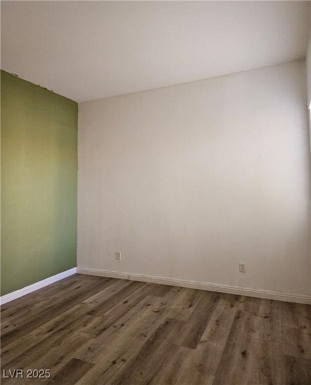 empty room featuring dark hardwood / wood-style floors