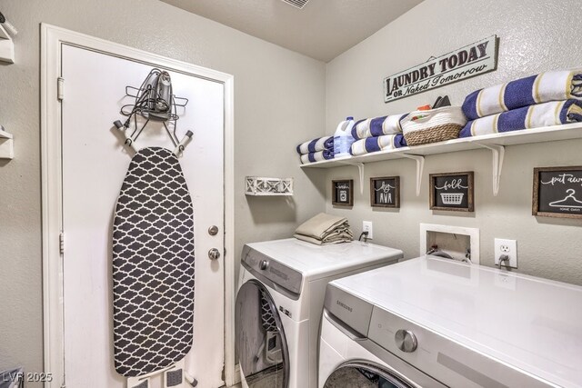 laundry room with washer and dryer