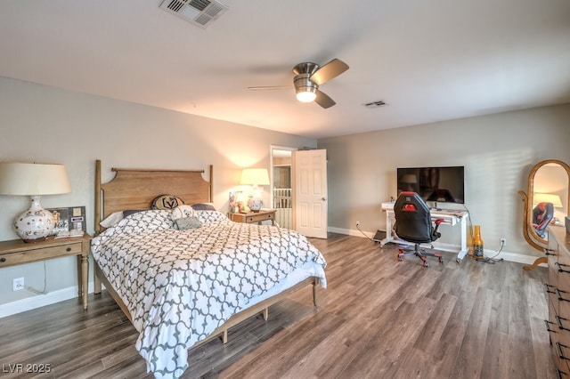 bedroom featuring ceiling fan and dark wood-type flooring