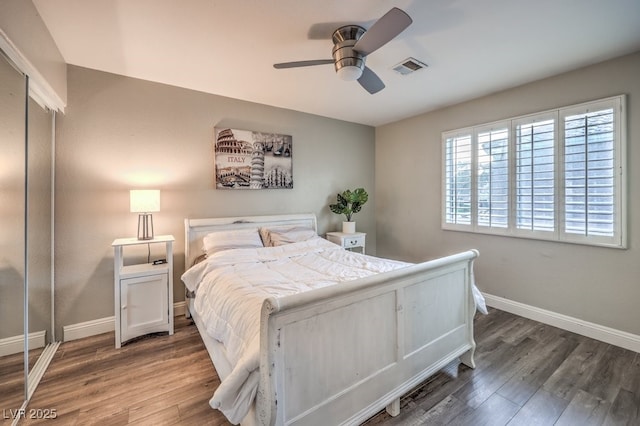 bedroom featuring dark hardwood / wood-style flooring and ceiling fan