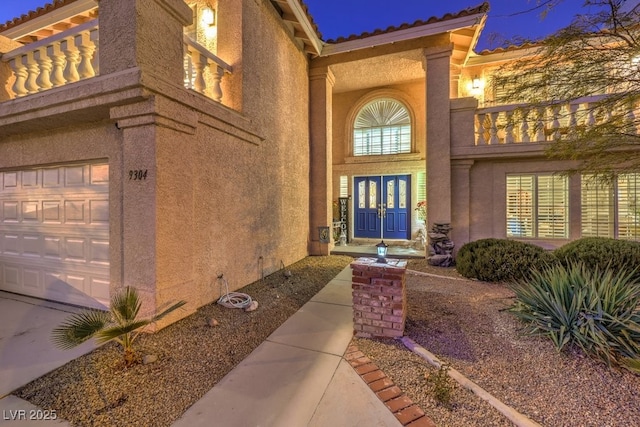 doorway to property featuring a garage