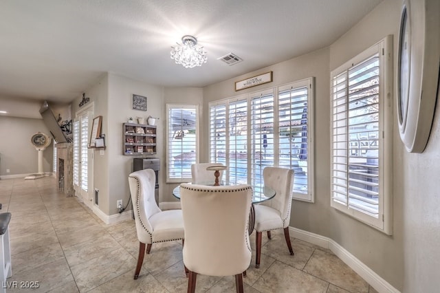 dining space featuring an inviting chandelier