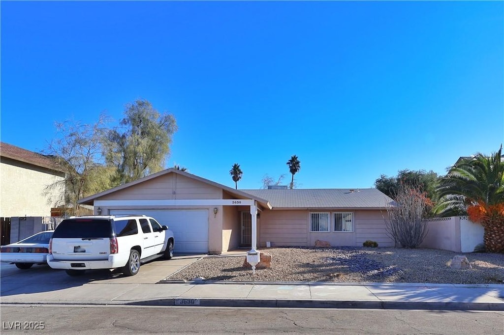 ranch-style house featuring a garage