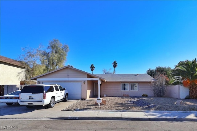 ranch-style house featuring a garage