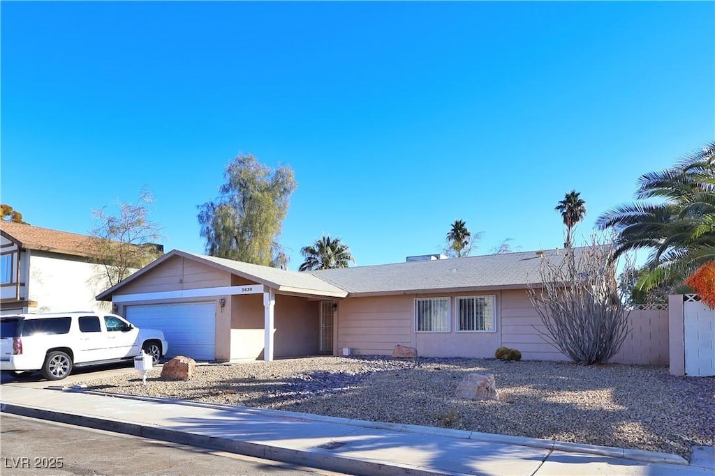 ranch-style house featuring a garage