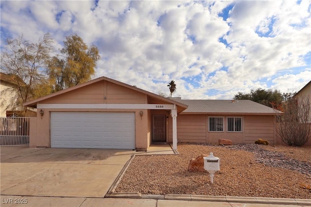 single story home featuring a garage